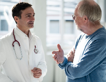 Doctor talking with older patient